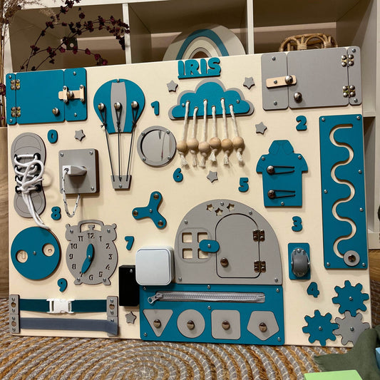 Turquoise busy board for toddlers with LED light