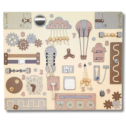 Children's educational busy board with various mechanical and abstract shapes on a beige background