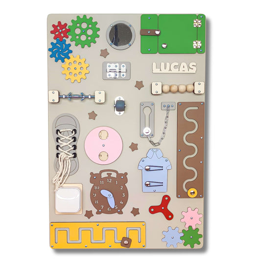 colourful toddler activity board with various educational elements on a wooden surface.