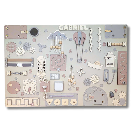 Baby pastel busy board with various educational elements on a white background